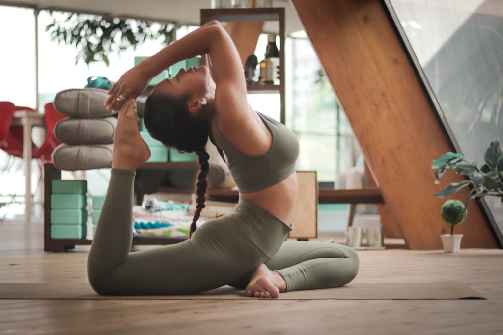 Harmonizing mind, body, and spirit with holistic therapies, woman doing yoga