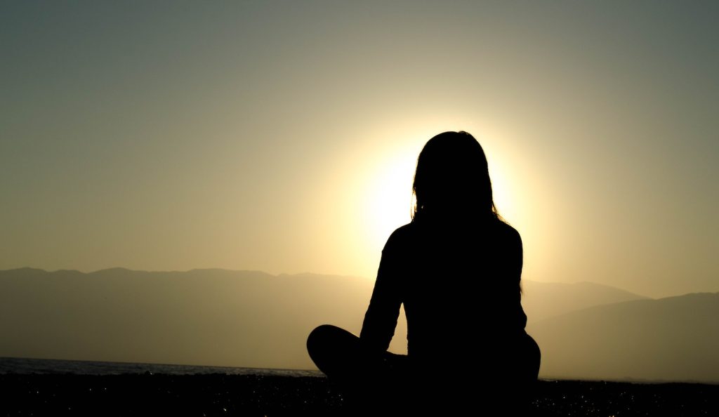 Individual meditation in a tranquil setting for anxiety relief